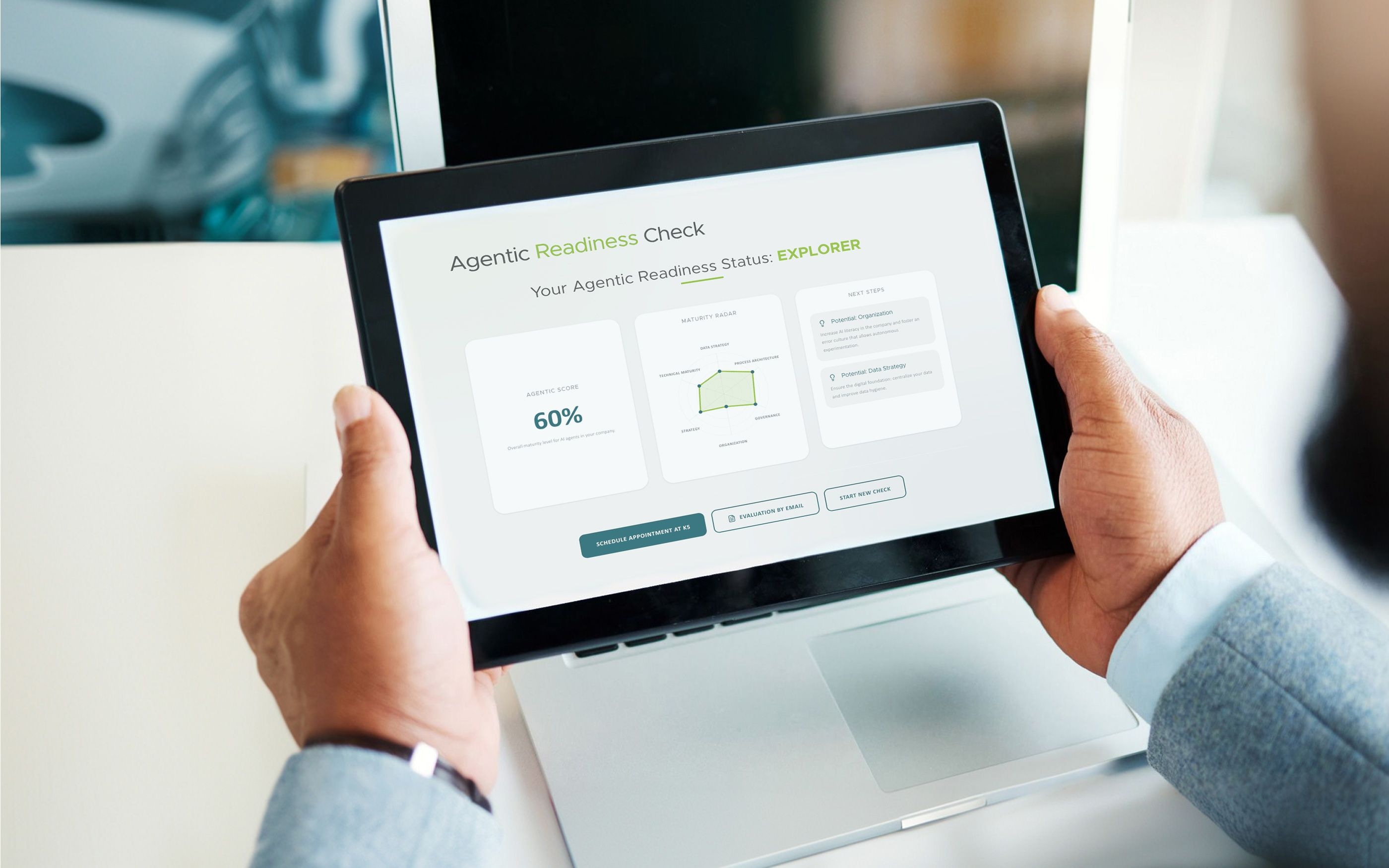 A person is holding a tablet displaying the “Agentic Readiness Status: Explorer” dashboard. The screen shows a score of 60%, a radar chart covering strategy, governance, and organization, as well as recommended next steps and action buttons at the bottom.